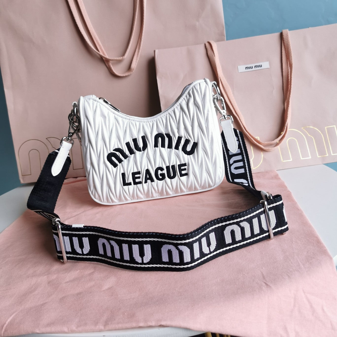 MIU MIU MATELASSé 21 BAG IN WHITE SATIN