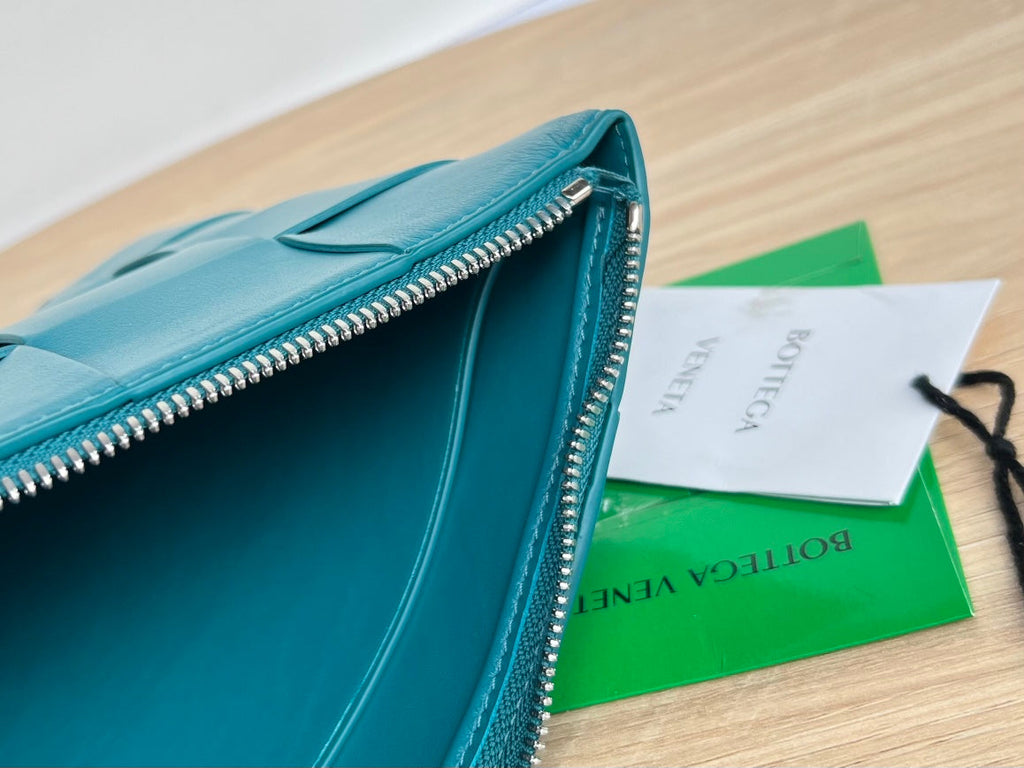 BOTTEGA VENETA LARGE CASSETTE POUCH 35 IN LAGOON BLUE CALFSKIN