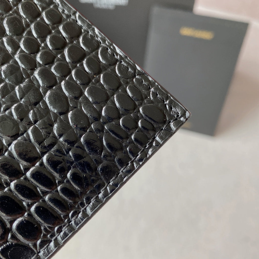 SAINT LAURENT UPTOWN POUCH 27 IN BLACK CROCODILE-EMBOSSED SHINY CALFSKIN GOLD LOGO