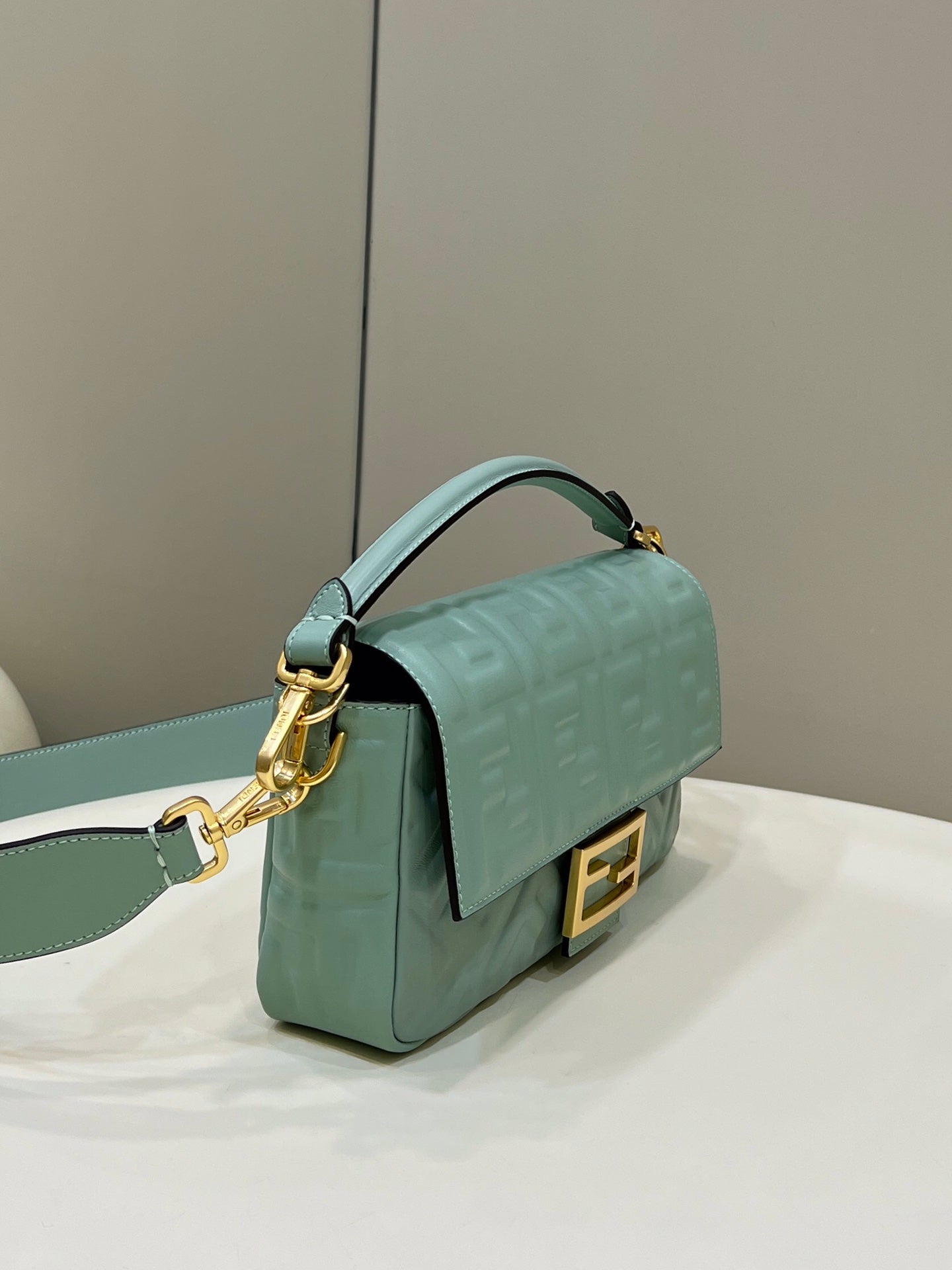 FENDI BAGUETTE WITH FF MOTIF 27 IN VIRIDIAN GREEN SOFT LAMBSKIN GOLD HARDWARE