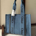 CHLOE MEDIUM WOODY TOTE BAG 37 IN BLUE DENIM BLACK CALFSKIN