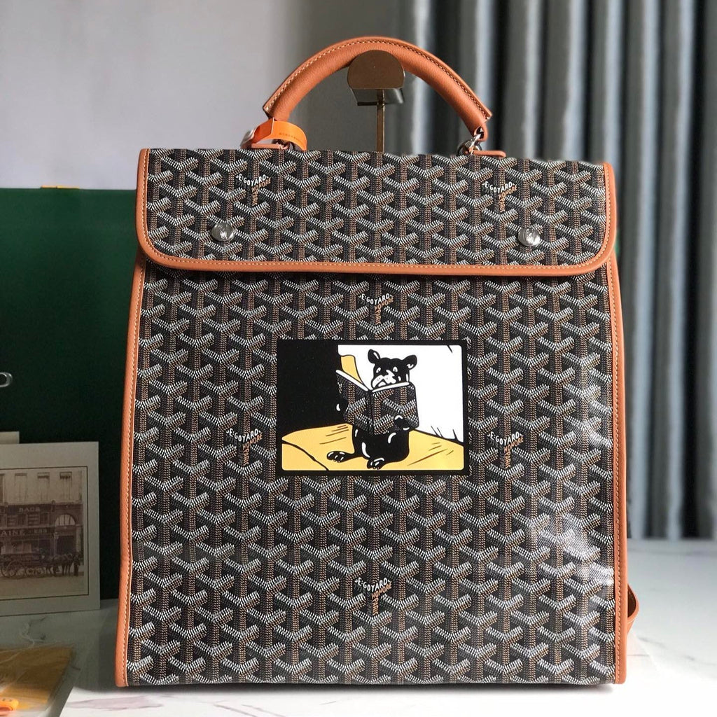 GOYARD SAINT LÉGER BACKPACK 35 IN BROWN GOYARDINE CANVAS AND CALFSKIN WITH CARTOON PATCH
