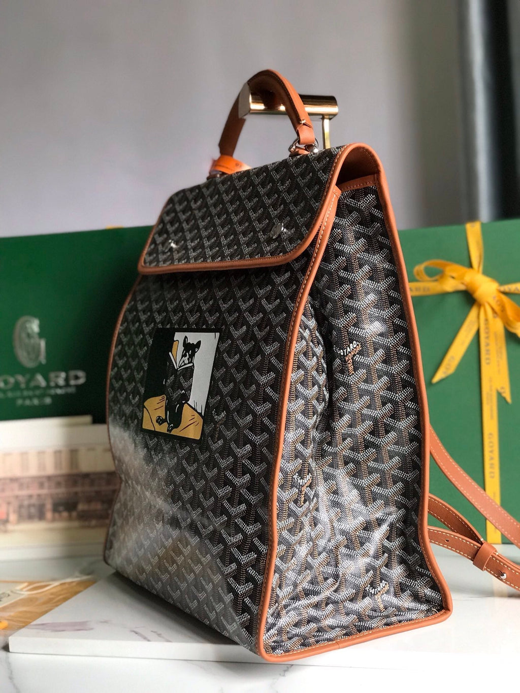 GOYARD SAINT LÉGER BACKPACK 35 IN BROWN GOYARDINE CANVAS AND CALFSKIN WITH CARTOON PATCH