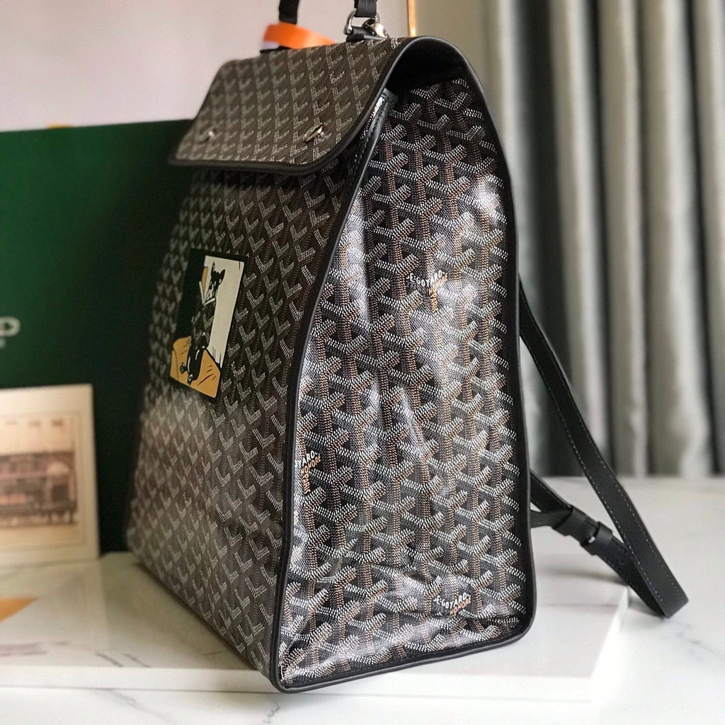 GOYARD SAINT LÉGER BACKPACK 35 IN BROWN MIX BALCK GOYARDINE CANVAS AND CALFSKIN WITH CARTOON PATCH