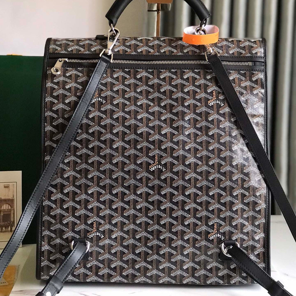 GOYARD SAINT LÉGER BACKPACK 35 IN BROWN MIX BALCK GOYARDINE CANVAS AND CALFSKIN WITH CARTOON PATCH