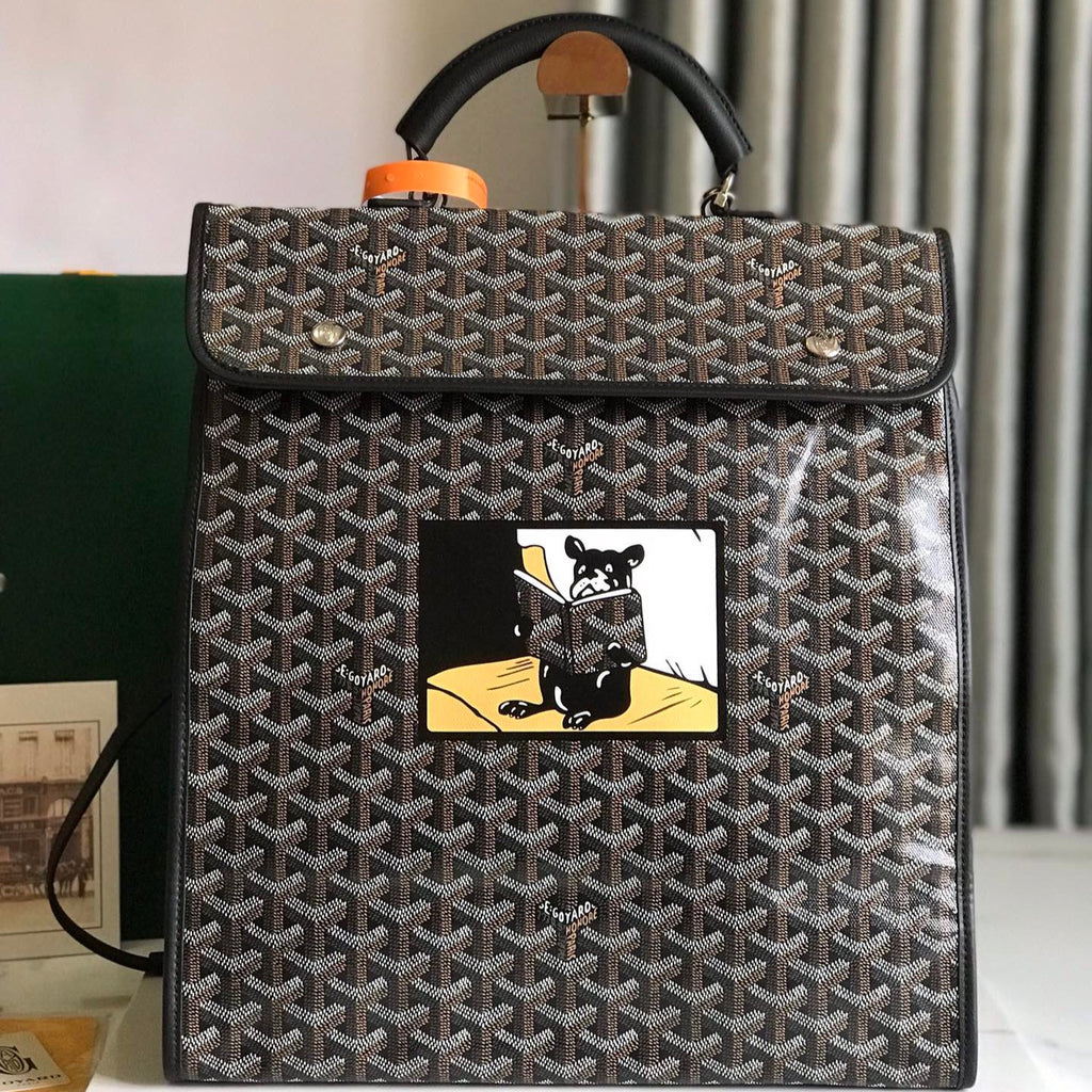 GOYARD SAINT LÉGER BACKPACK 35 IN BROWN MIX BALCK GOYARDINE CANVAS AND CALFSKIN WITH CARTOON PATCH