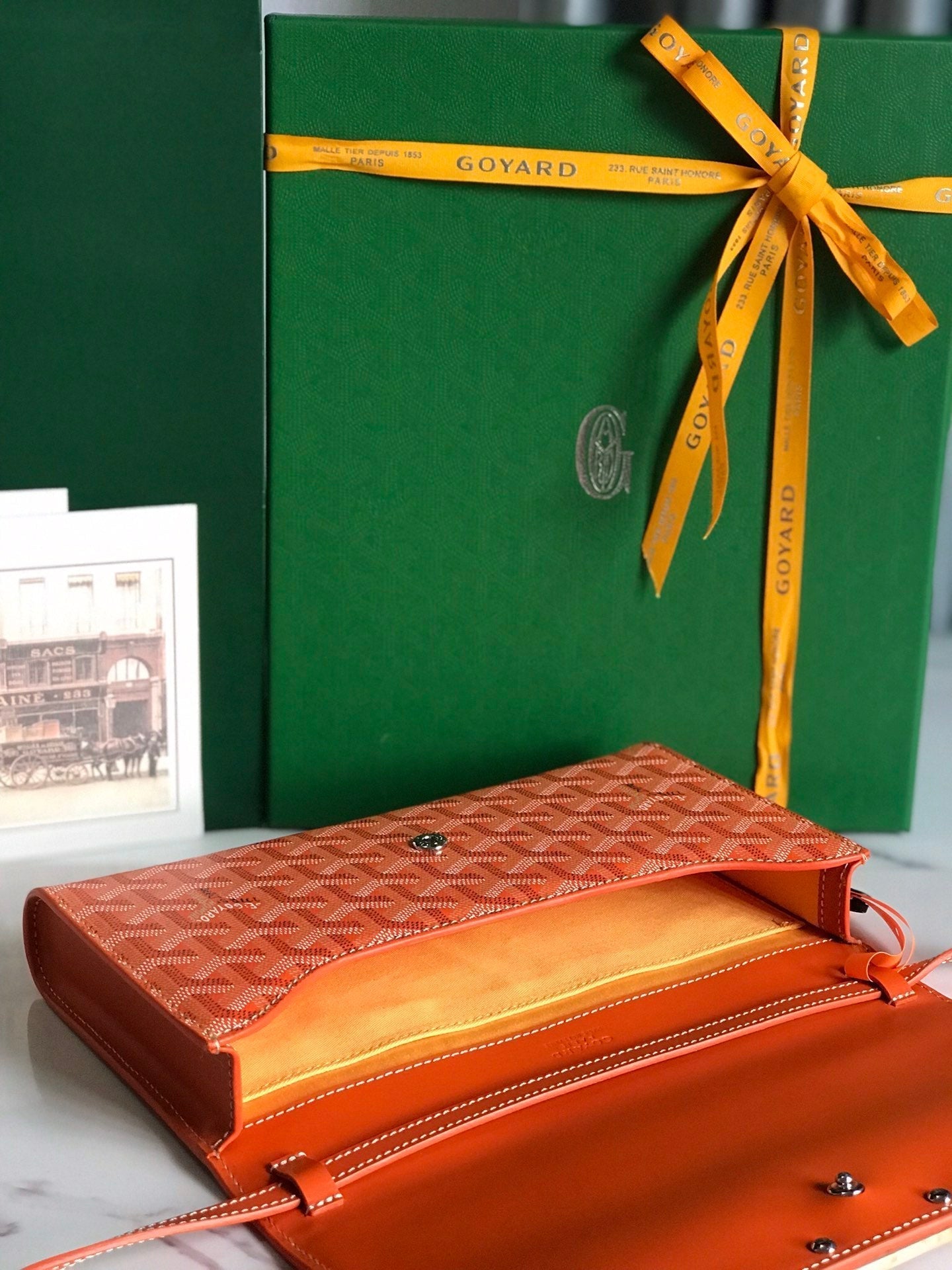 GOYARD MONTE-CARLO PM CLUTCH 25 IN ORANGE GOYARDINE CANVAS
