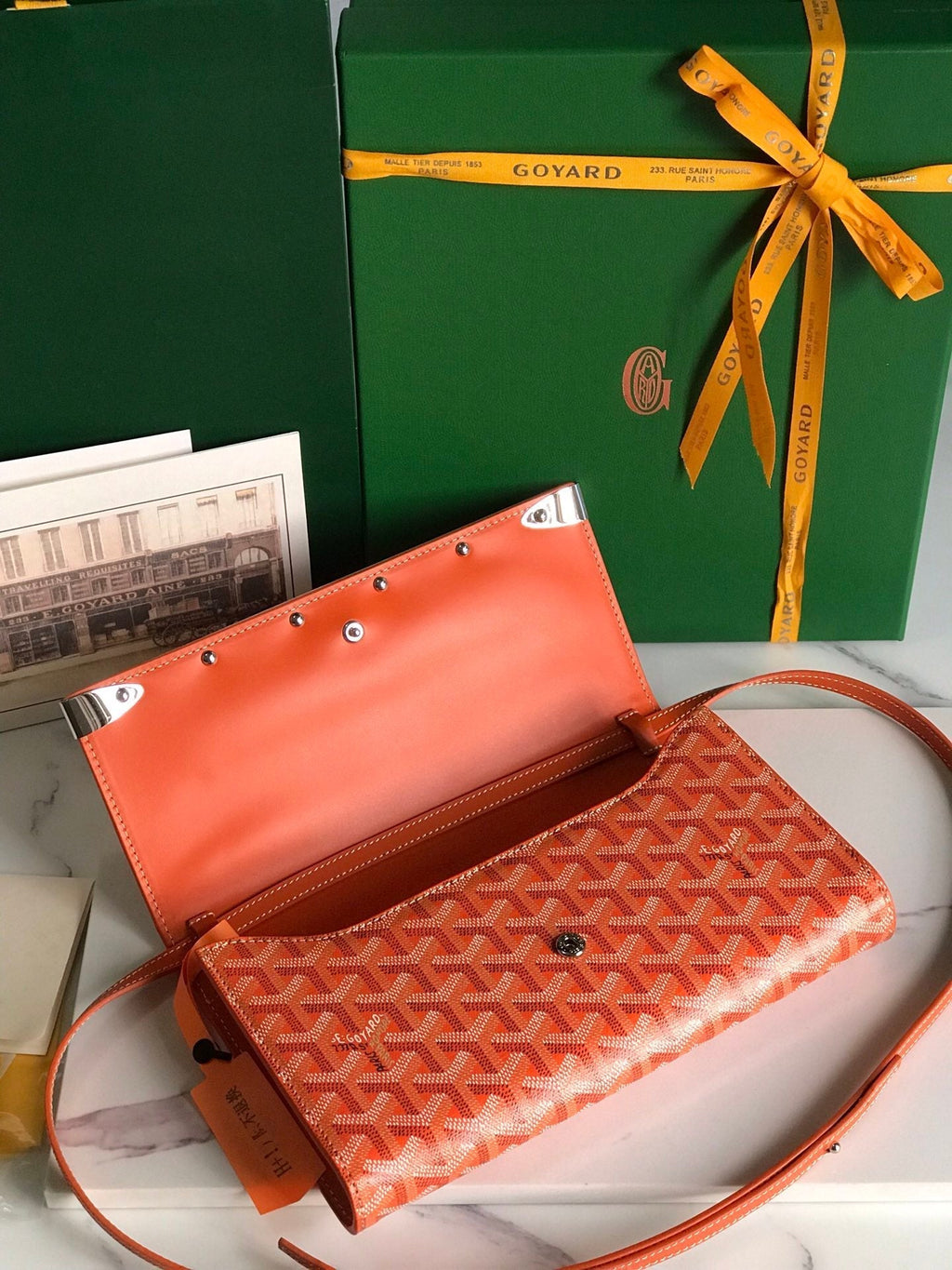 GOYARD MONTE-CARLO PM CLUTCH 25 IN ORANGE GOYARDINE CANVAS