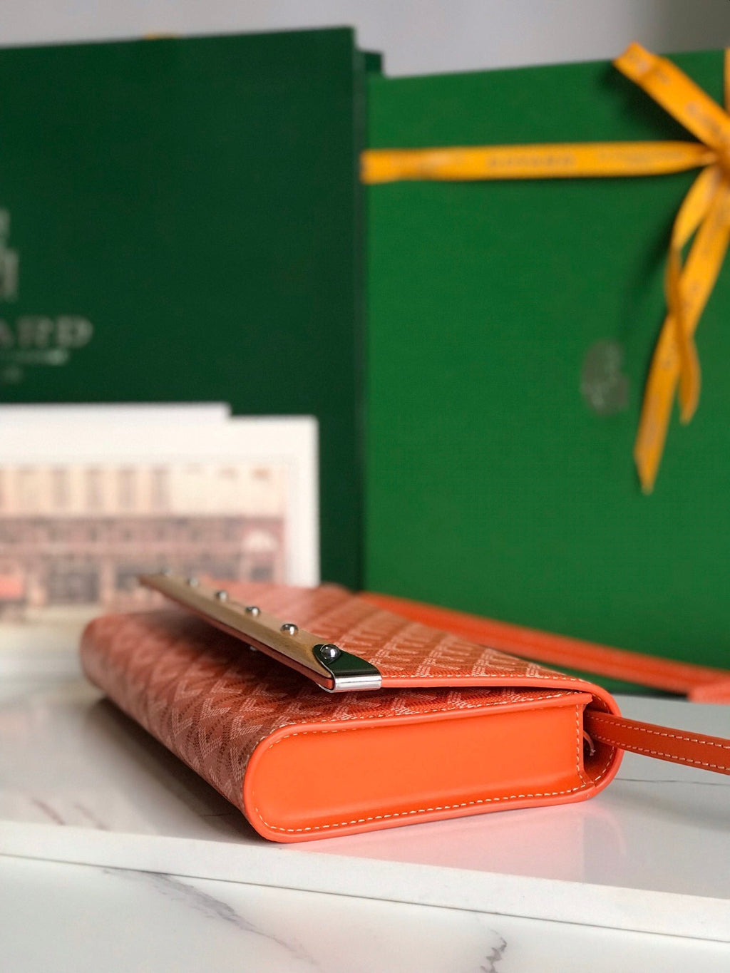 GOYARD MONTE-CARLO PM CLUTCH 25 IN ORANGE GOYARDINE CANVAS