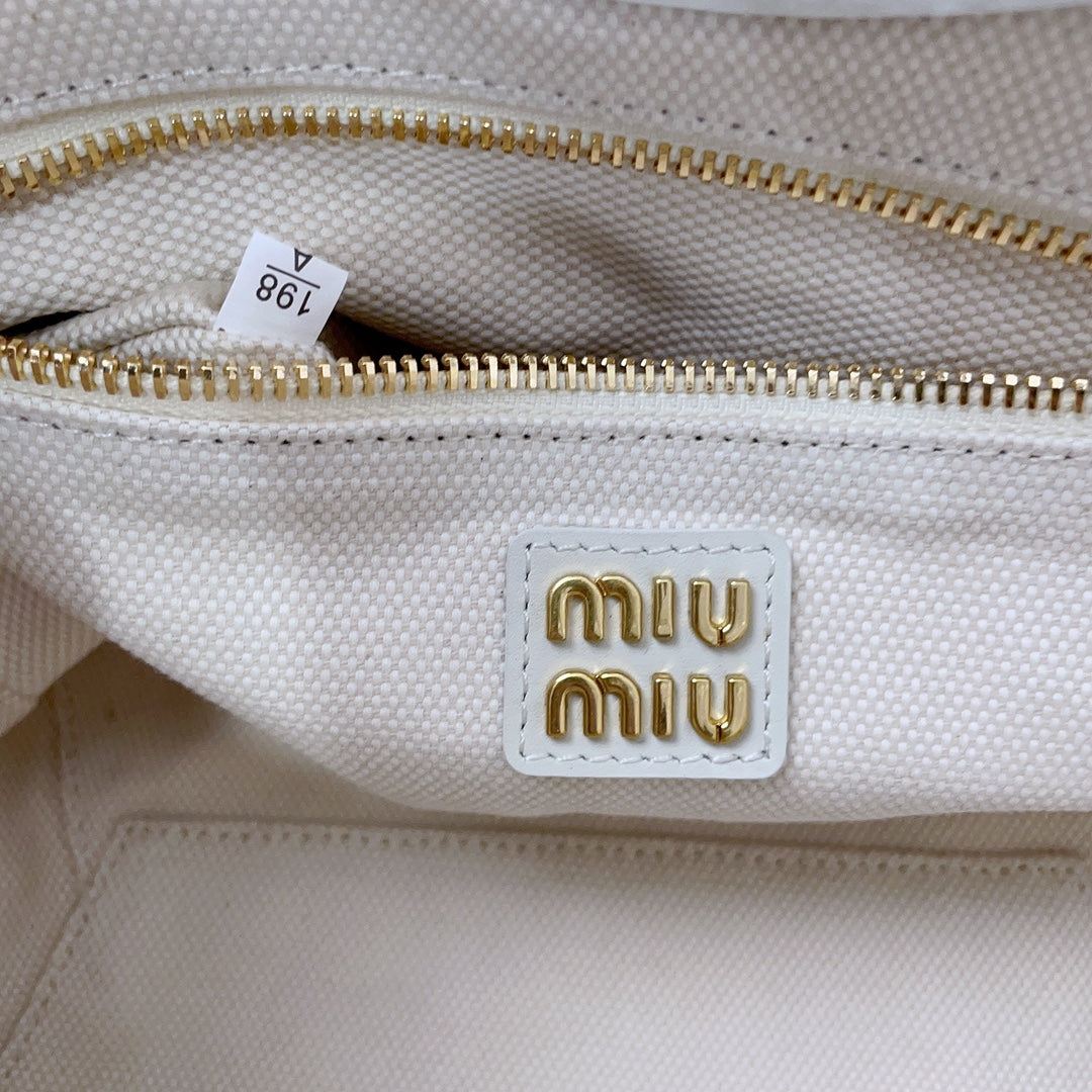 MIU MIU IVY HANDBAG 22 IN WHITE CANVAS