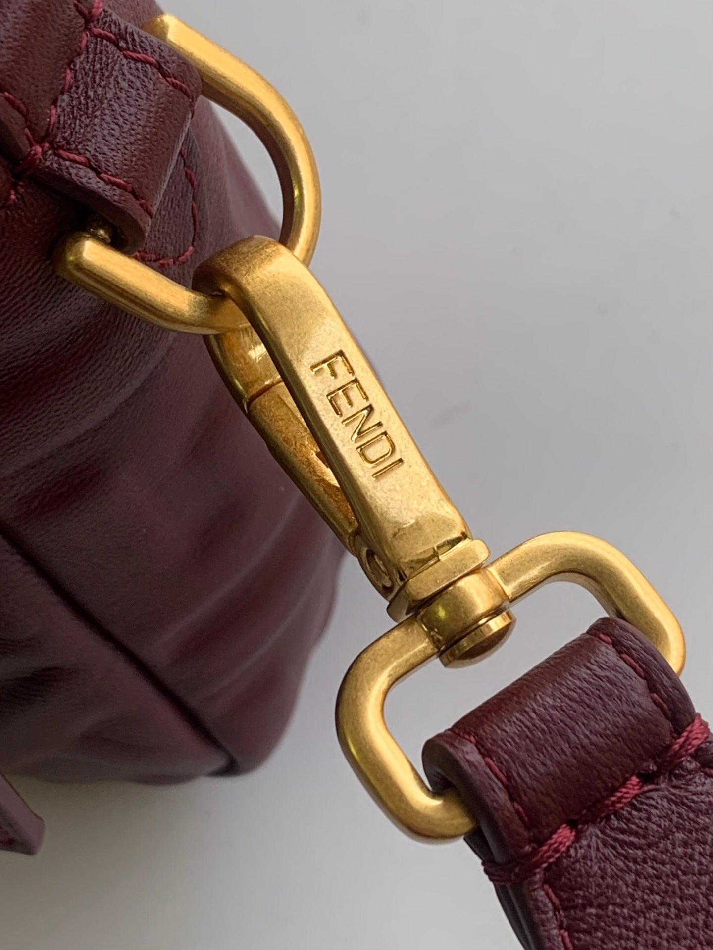 FENDI Fend Baguette 27 Bag With FF Motif Burgundy Leather Ghw