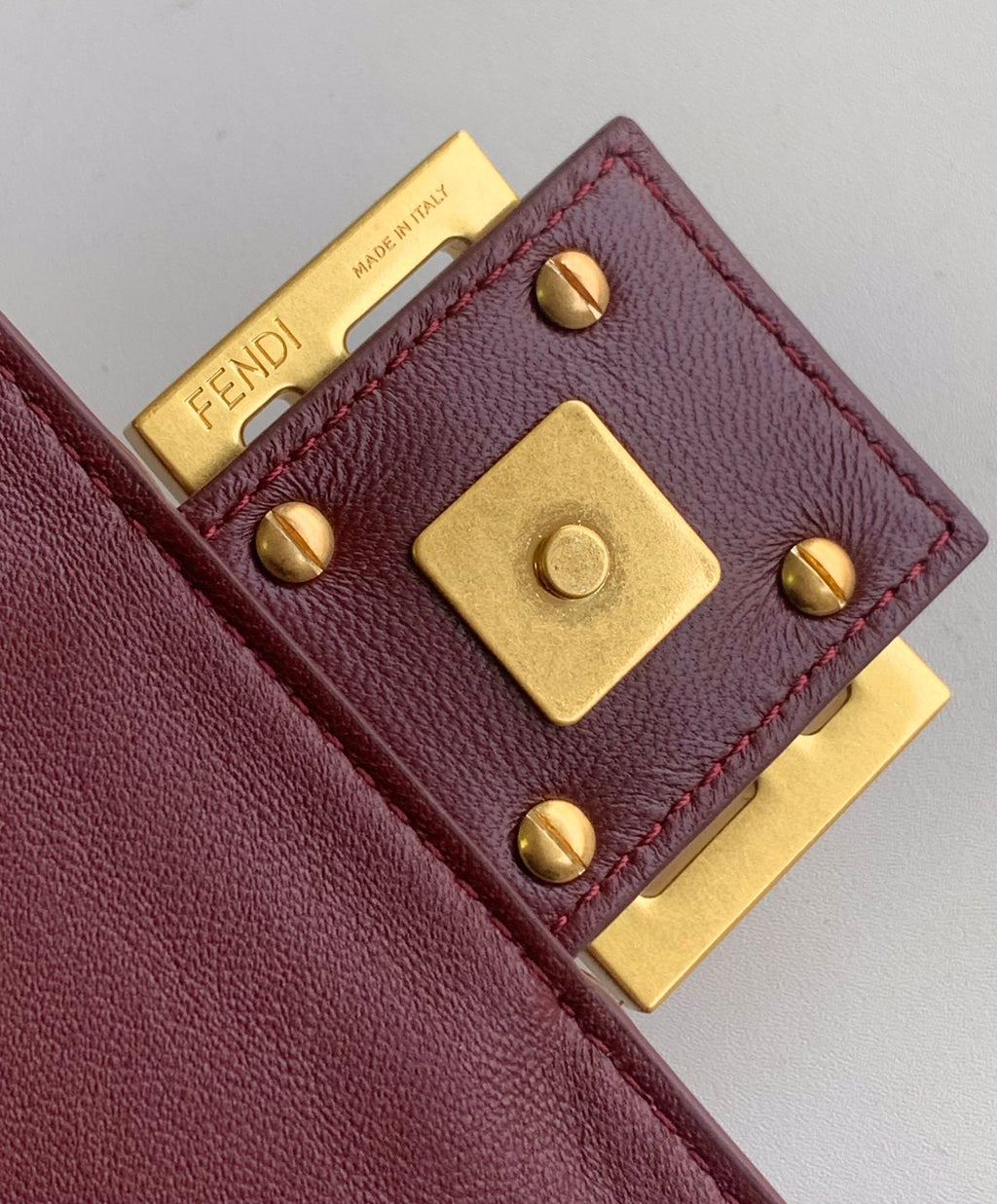 FENDI Fend Baguette 27 Bag With FF Motif Burgundy Leather Ghw
