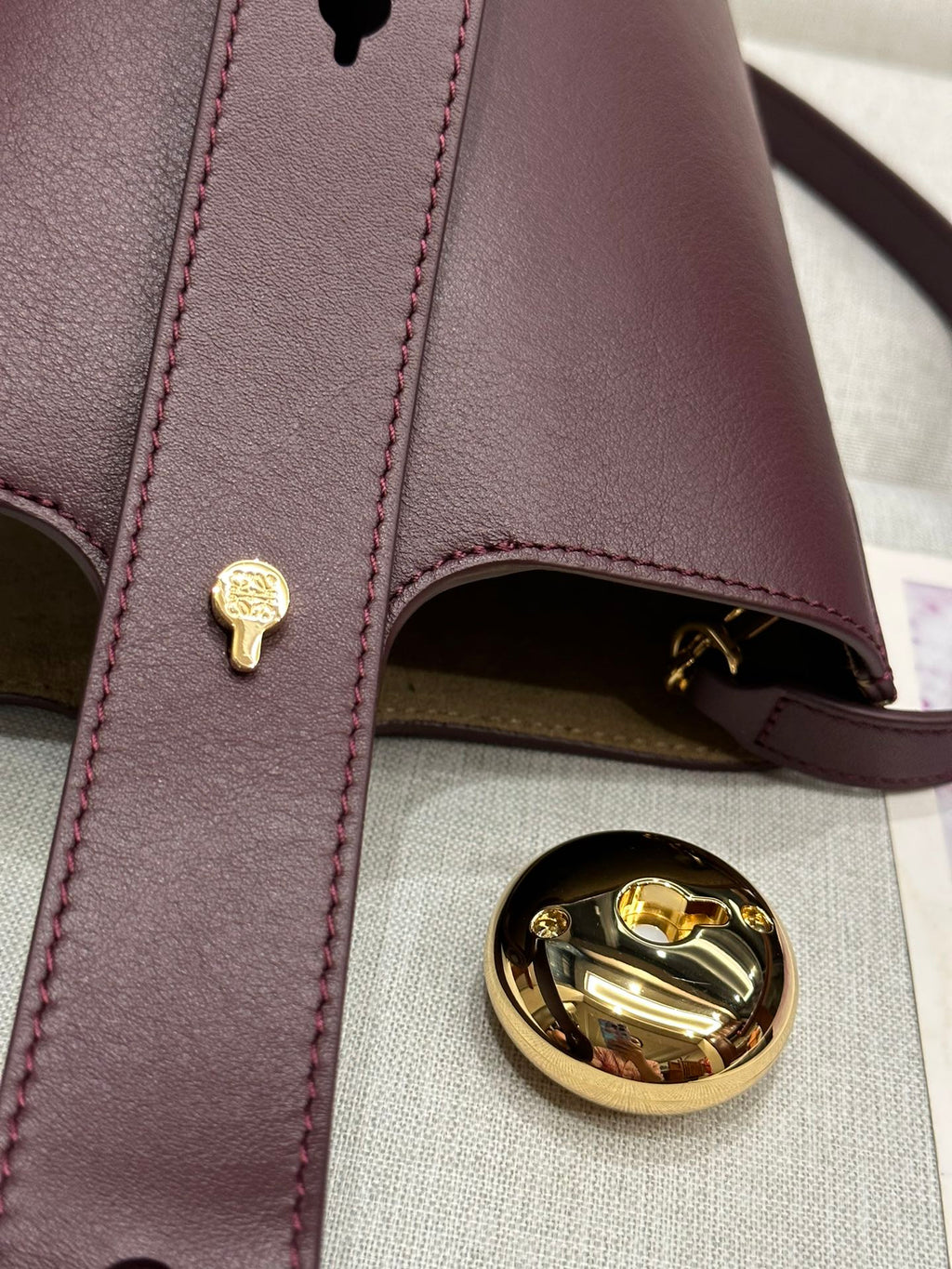 LOEWE LOE MINI 19 PEBBLE BUCKET IN DARK BURGUNDY MELLOW CALFSKIN