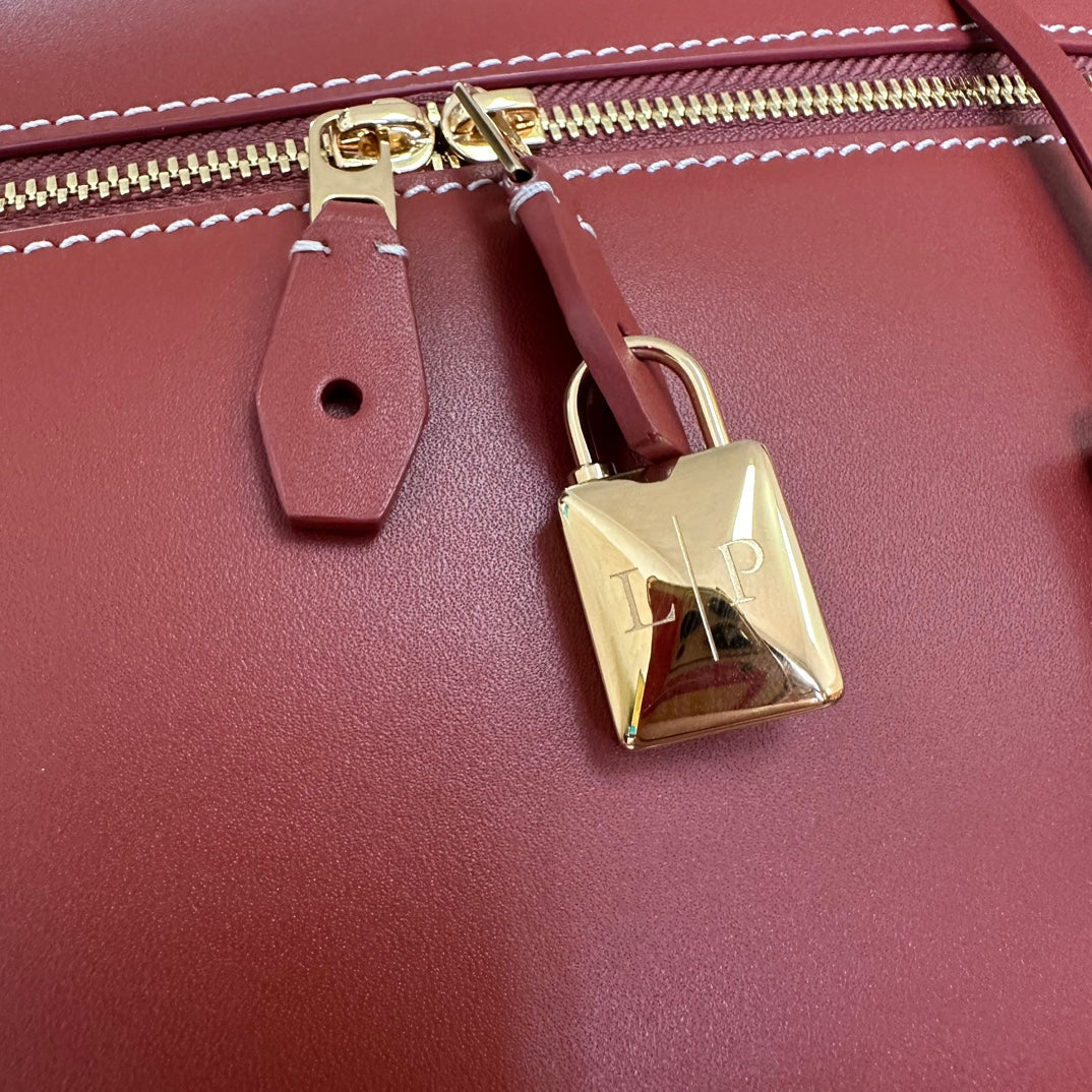 LORO PIANA EXTRA BAG L27 IN MARS RED SMOOTH CALFSKIN WITH GOLD HARDWARE