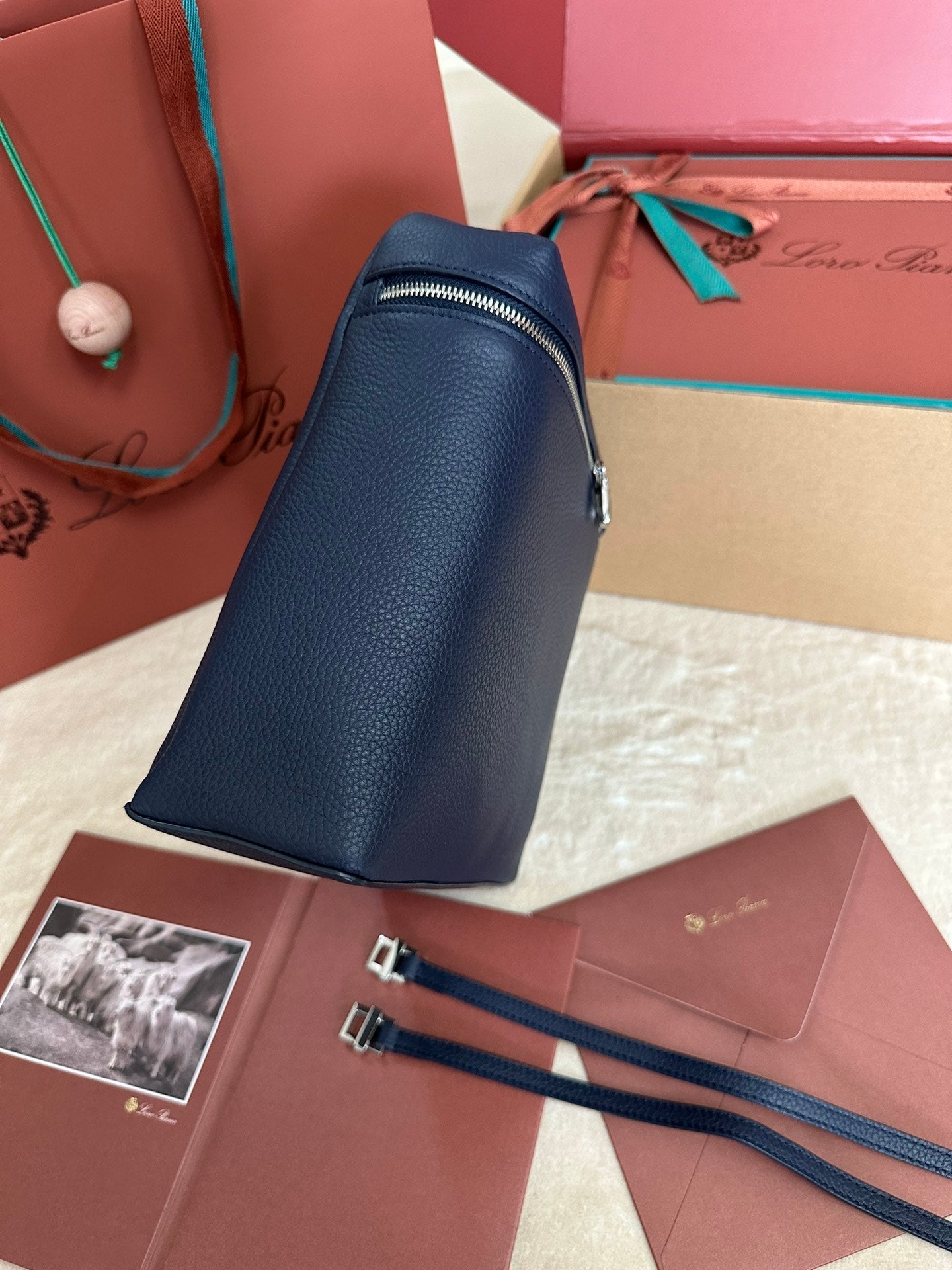 LORO PIANA EXTRA POCKET BACKPACK L23.5 IN NAVY BLUE CALFSKIN WITH SILVER HARDWARE