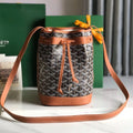 GOYARD PETIT FLOT BUCKET BAG 22 IN BLACK GOYARDINE CANVAS AND TAN LAMBSKIN TRIM