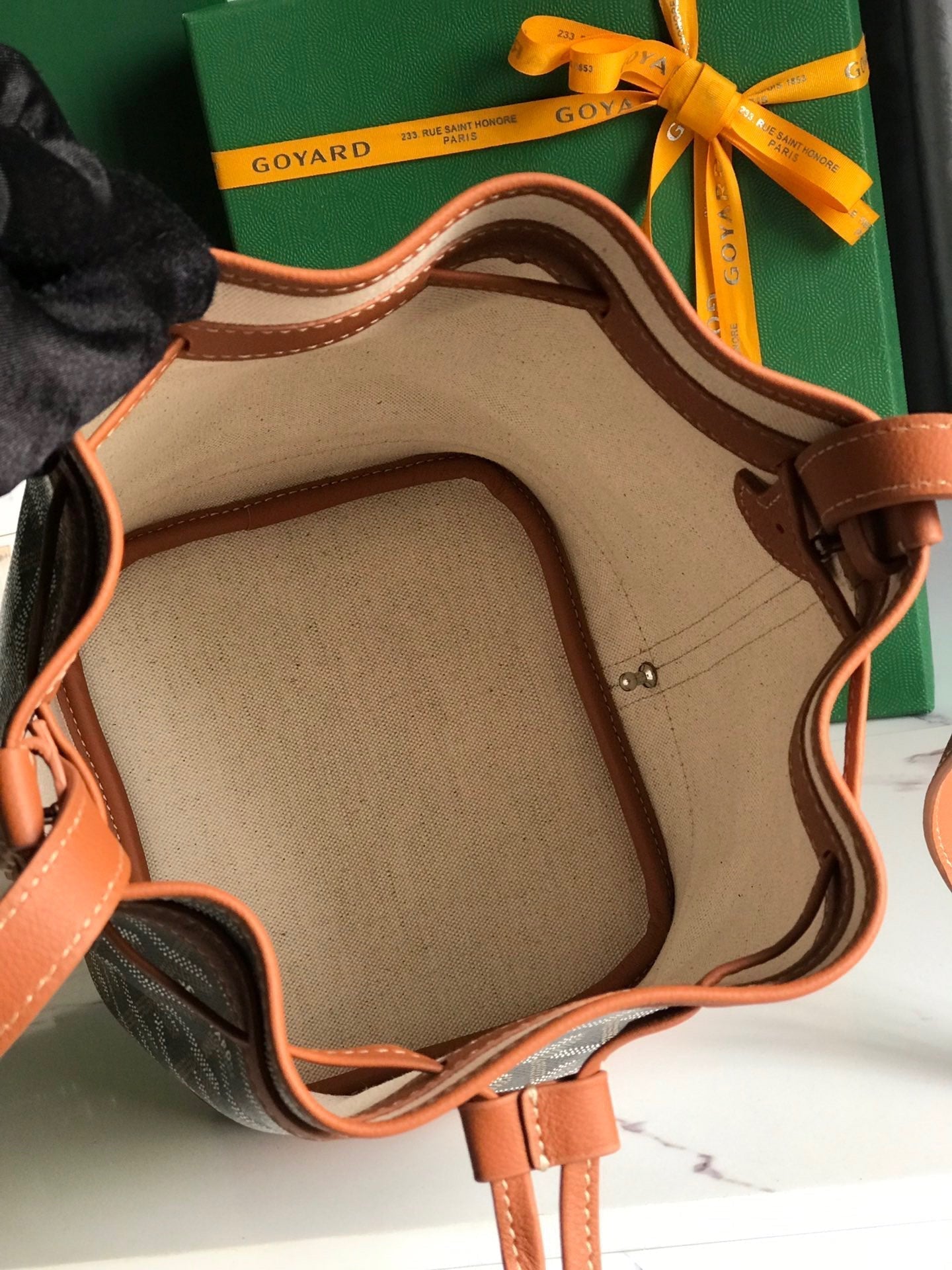 GOYARD PETIT FLOT BUCKET BAG 22 IN BLACK GOYARDINE CANVAS AND TAN LAMBSKIN TRIM