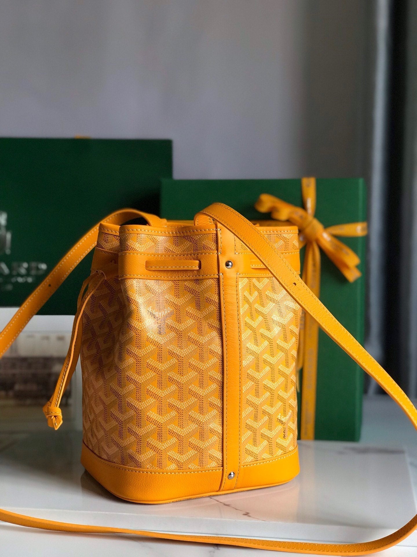 GOYARD PETIT FLOT BUCKET BAG 22 IN YELLOW GOYARDINE CANVAS AND LAMBSKIN TRIM