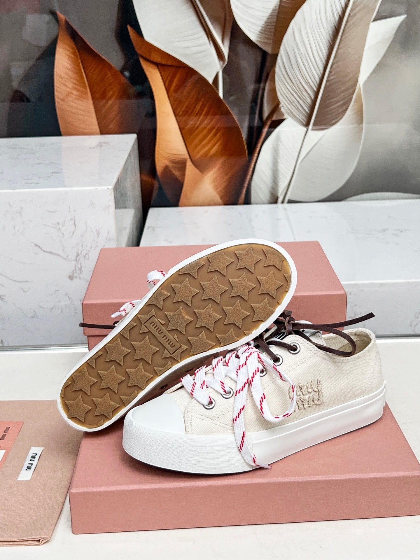 WASHED-DENIM SNEAKERS IN OFF WHITE CANVAS WITH BROWN AND STRIPED LACES