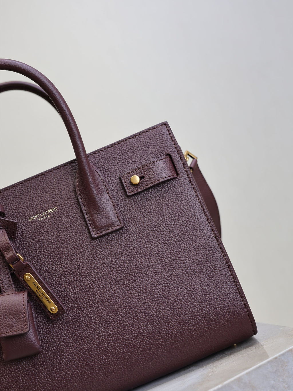 SAINT LAURENT YSL 25S SAC DE JOUR MM 26 IN ROUGE CABERNET SUPPLE GRAINED CALFSKIN