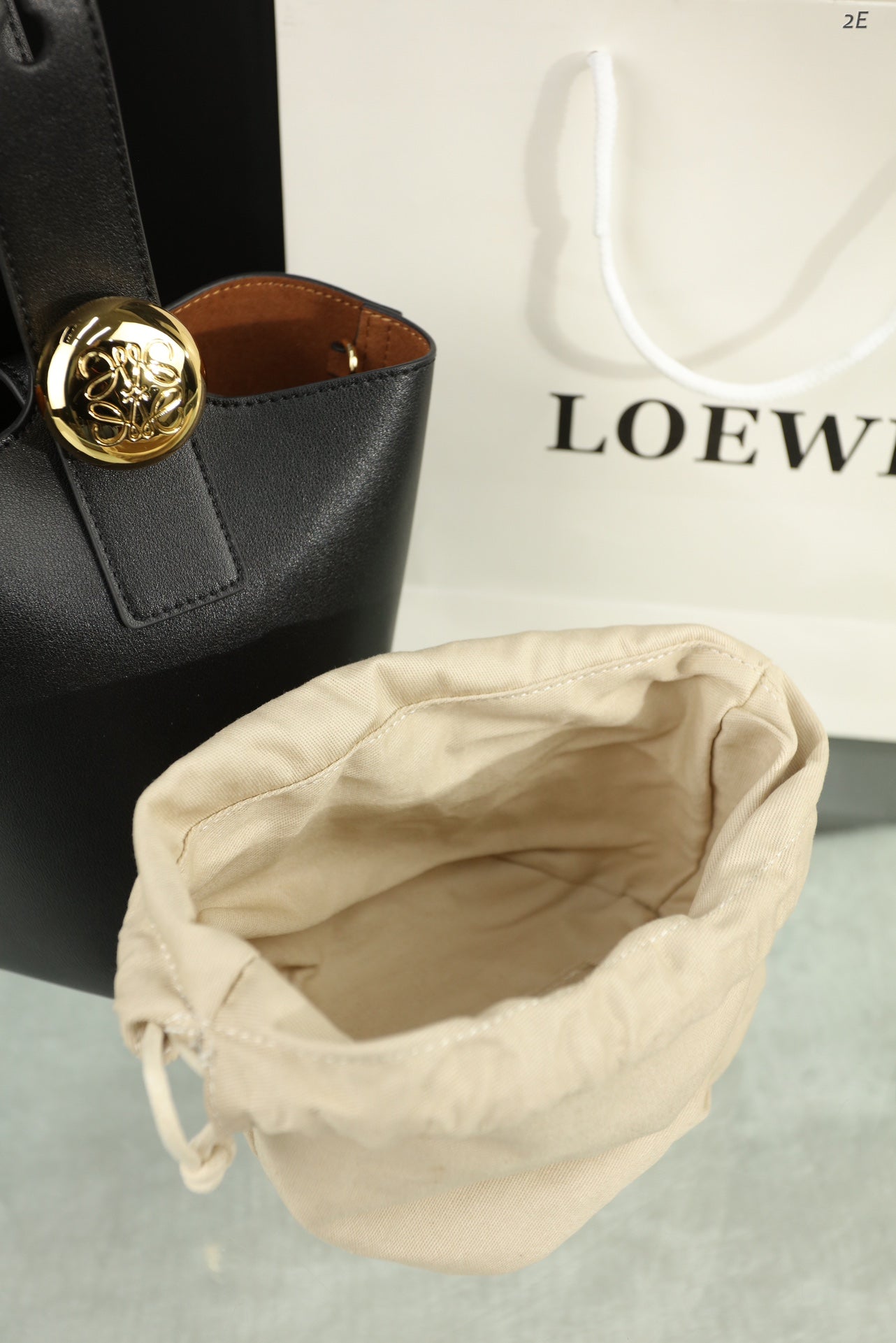 LOEWE LOE MINI 19 PEBBLE BUCKET IN BLACK MELLOW CALFSKIN
