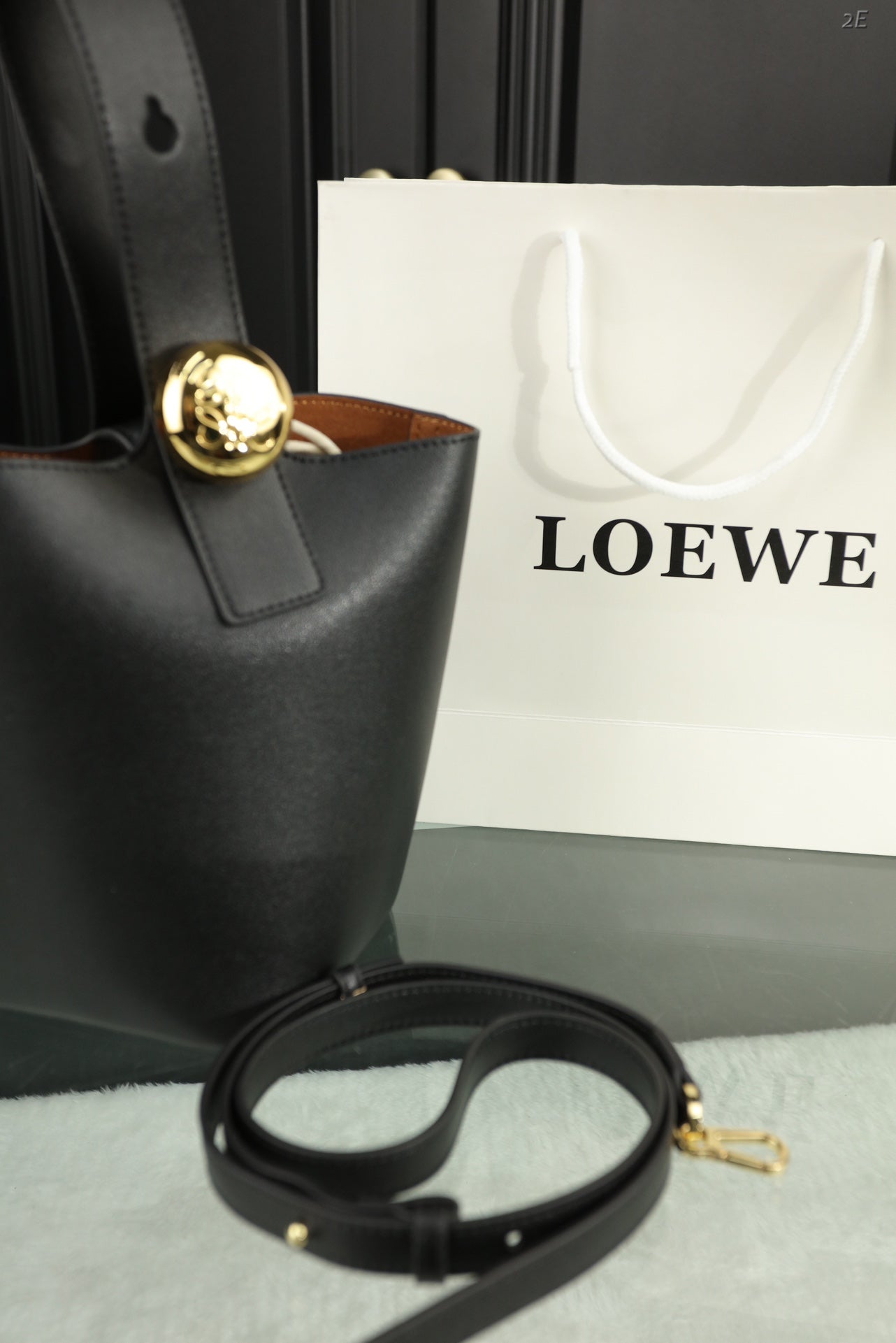 LOEWE LOE MINI 19 PEBBLE BUCKET IN BLACK MELLOW CALFSKIN
