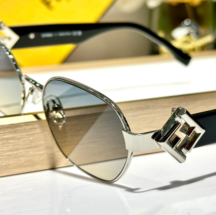 TRAVEL ROUND FRAME SUNGLASSES FE40148l IN METAL AND ACETATE