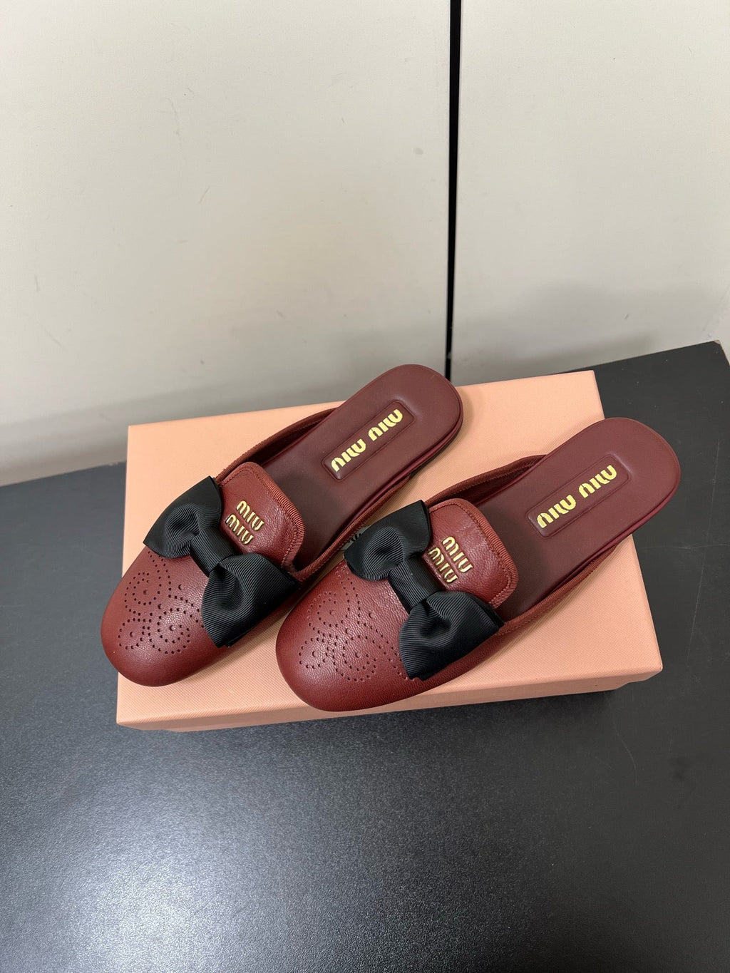 BOW MULES IN RED BROWN SHEEPSKIN