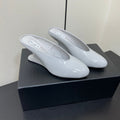 ALAIA WEDGE MULES 25S IN WHITE LAMBSKIN
