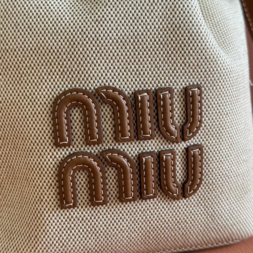 MIU MIU BUCKET BAG 22 BEIGE AND BRANDY IN CANVAS