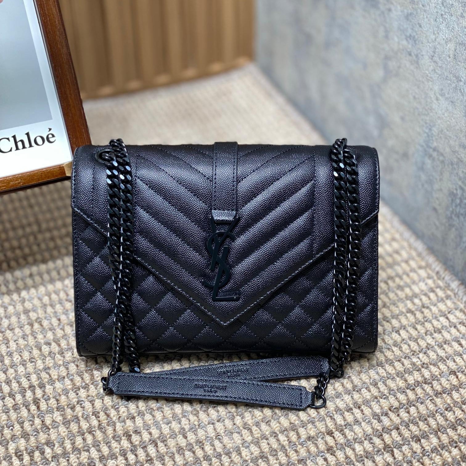 SAINT LAURENT ENVELOPE CHAIN BAG 24 IN BLACK CALFSKIN