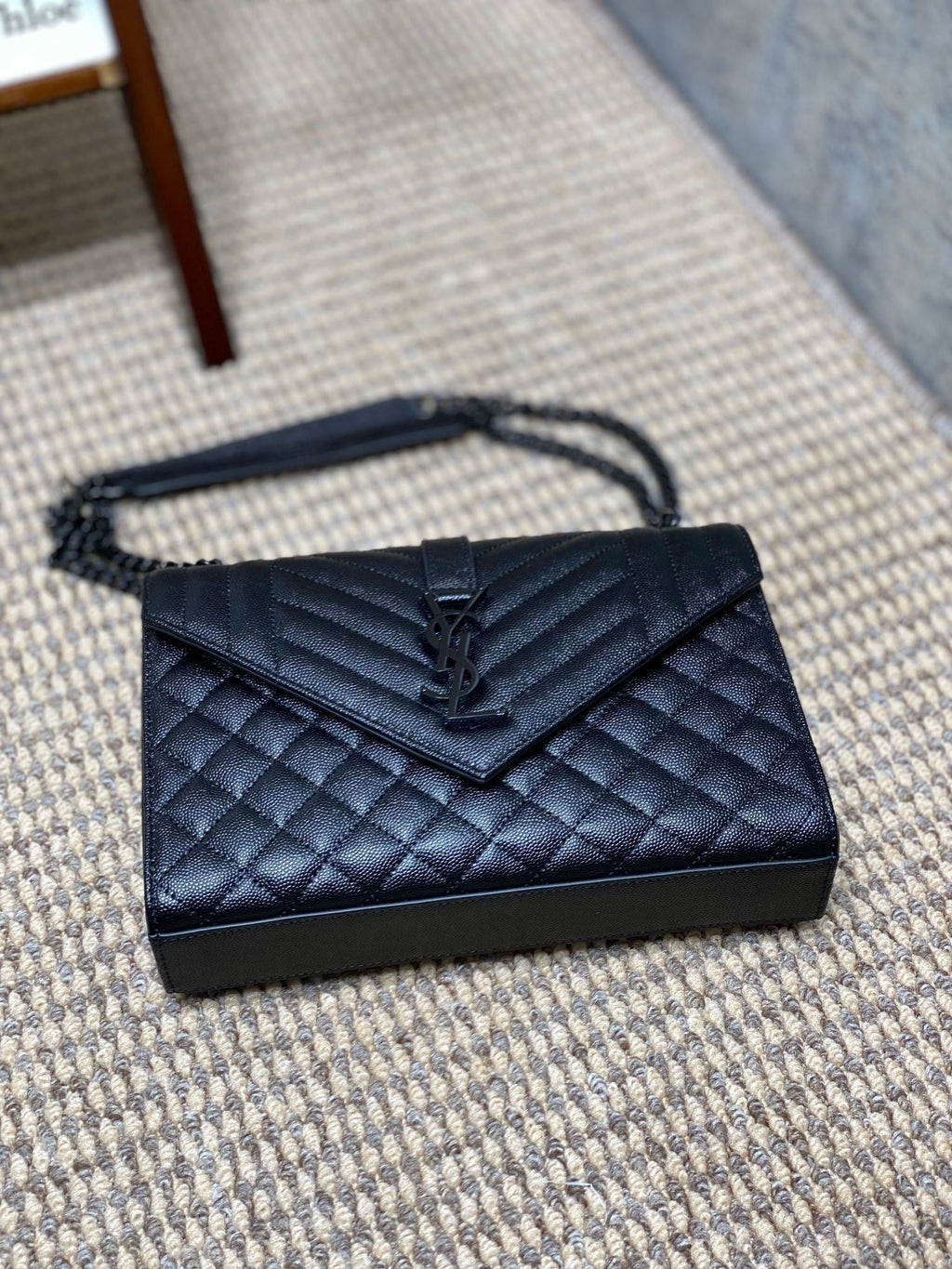 SAINT LAURENT ENVELOPE CHAIN BAG 24 IN BLACK CALFSKIN