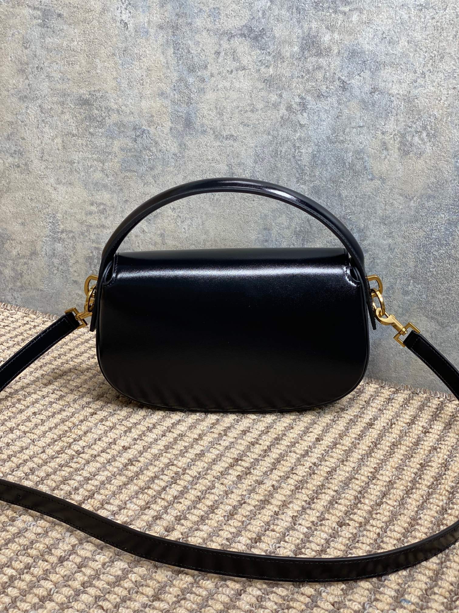 SAINT LAURENT VOLTAIRE HALF-MOON SHOULDER BAG 24 IN BLACK CALFSKIN GOLD METALLIC