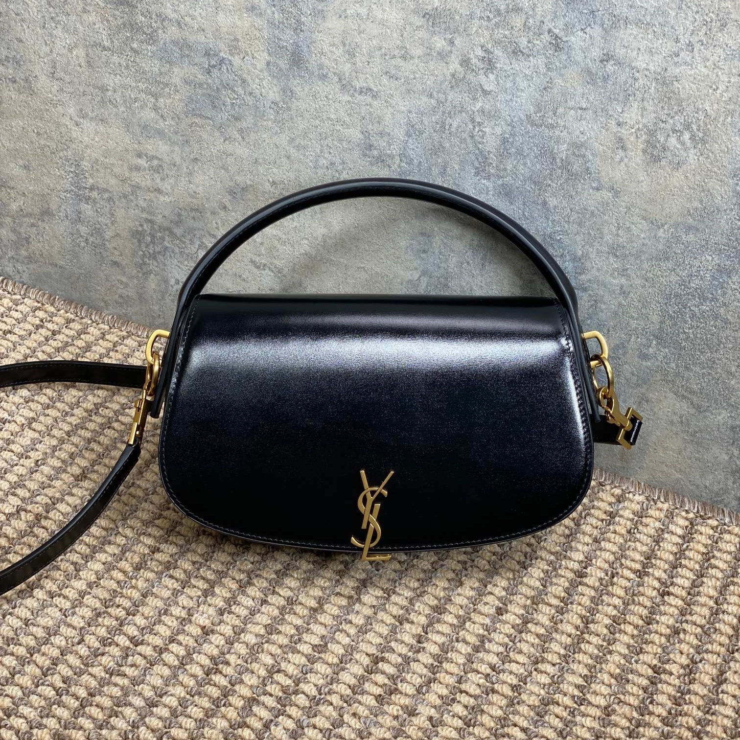 SAINT LAURENT VOLTAIRE HALF-MOON SHOULDER BAG 24 IN BLACK CALFSKIN GOLD METALLIC