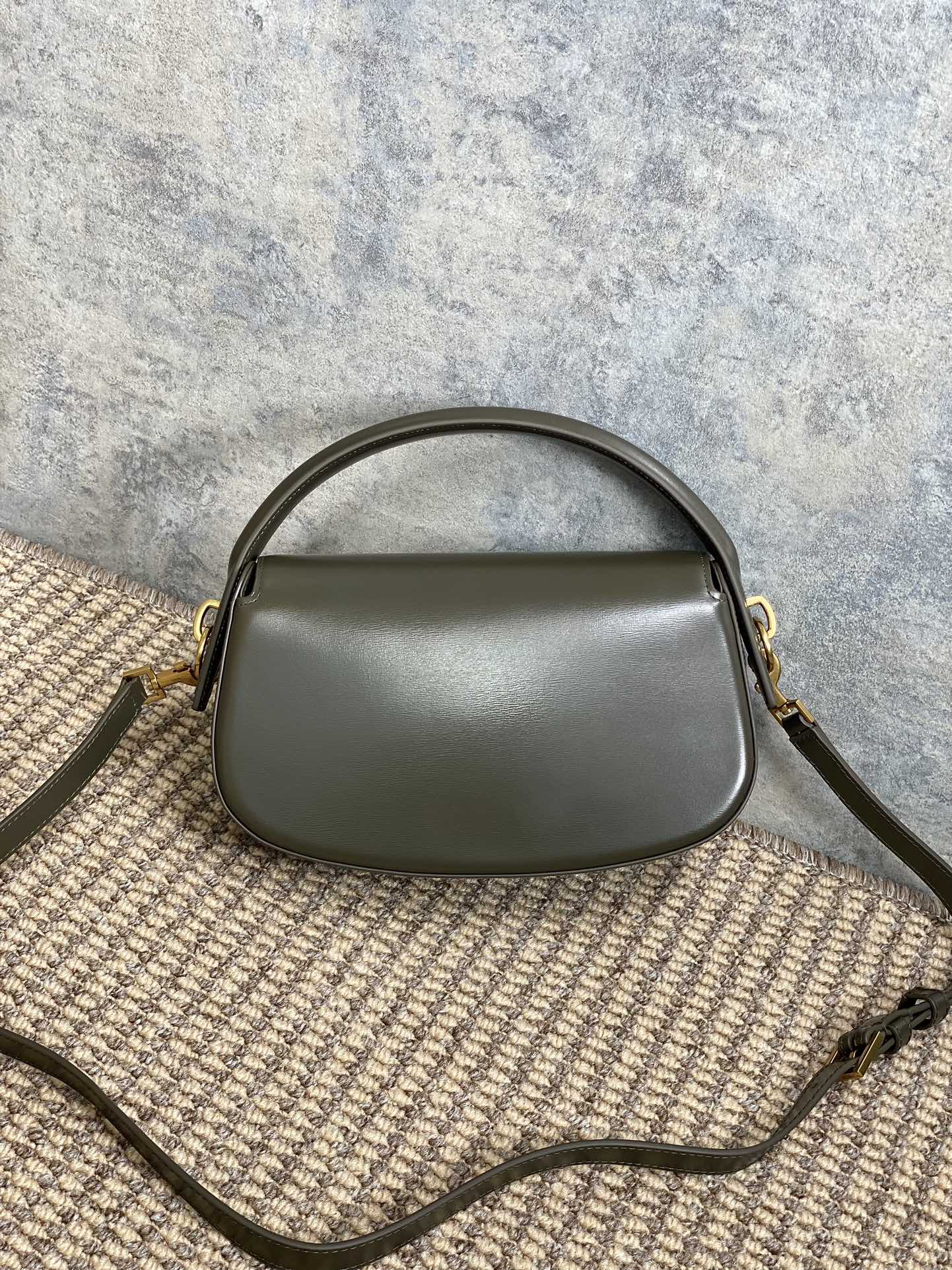 SAINT LAURENT VOLTAIRE HALF-MOON SHOULDER BAG 24 IN DARK GREEN CALFSKIN GOLD METALLIC