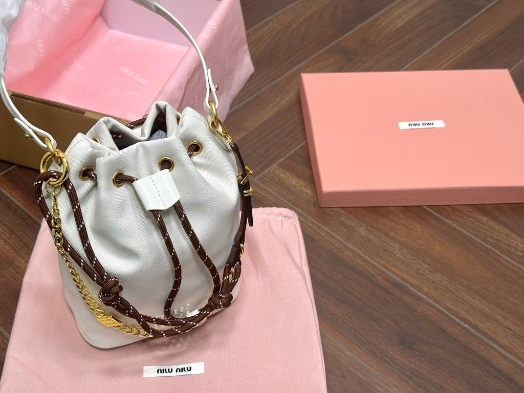 MIU MIU DRAWSTRING BUCKET BAG 21 IN WHITE CANVAS GOLD HARDWARE