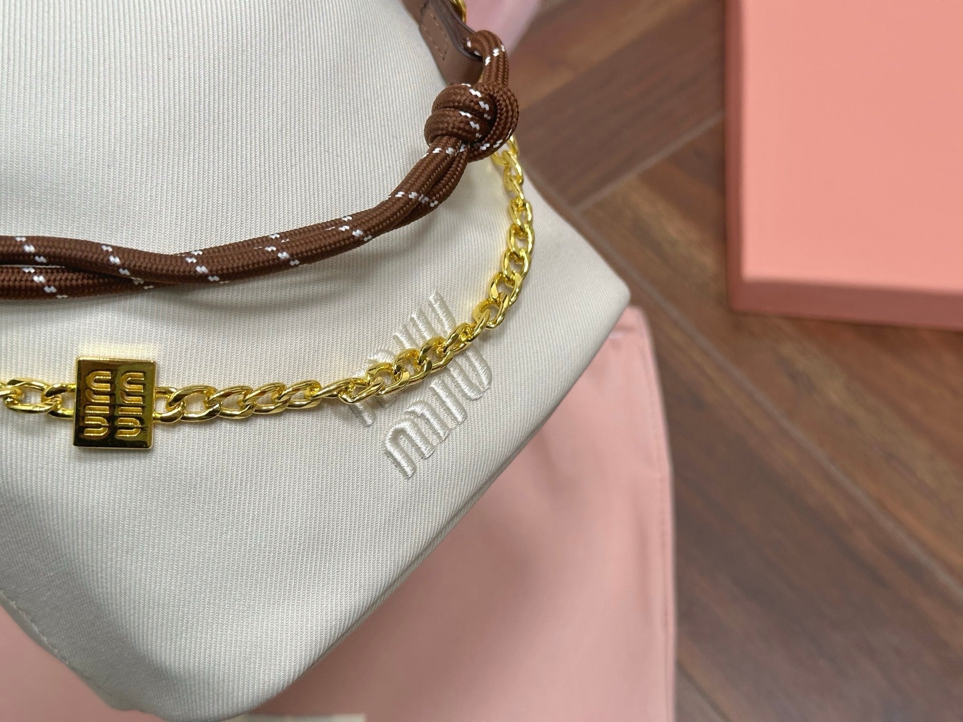 MIU MIU DRAWSTRING BUCKET BAG 21 IN WHITE CANVAS GOLD HARDWARE