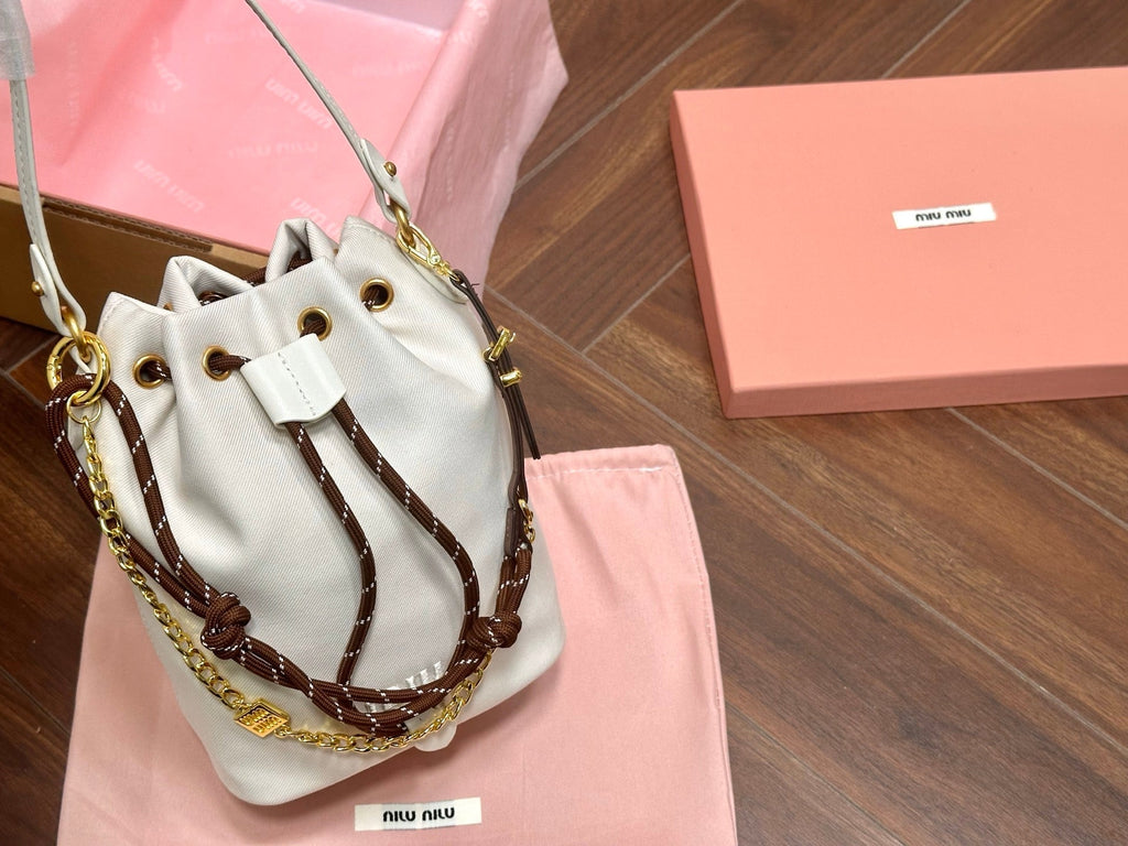 MIU MIU DRAWSTRING BUCKET BAG 21 IN WHITE CANVAS GOLD HARDWARE