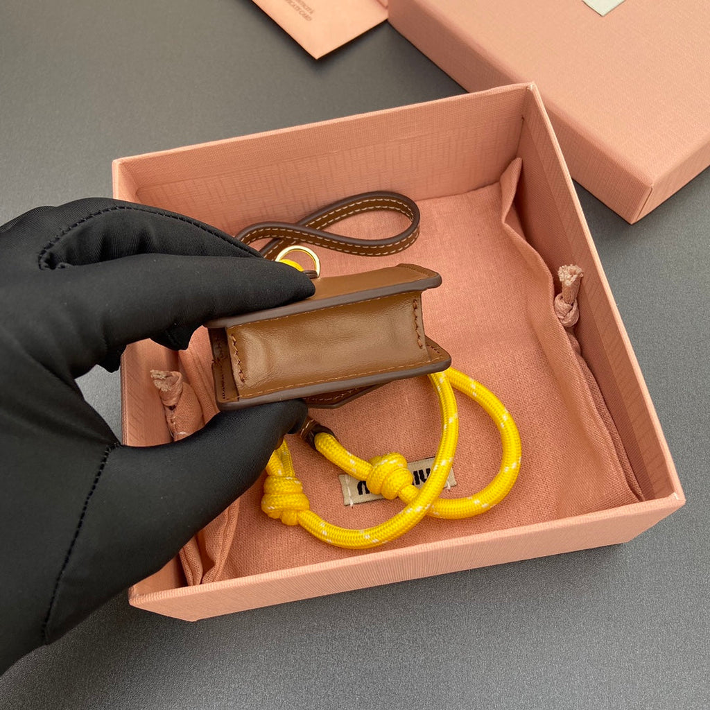 MIU MIU MICRO BAG 7 IN TAWNY BROWN SMOOTH LAMBSKIN YELLOW STRAP