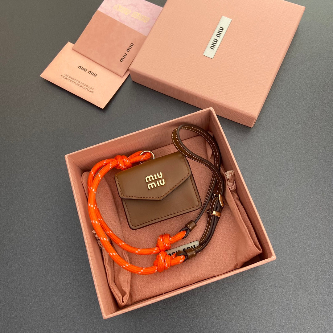 MIU MIU MICRO BAG 7 IN TAWNY BROWN SMOOTH LAMBSKIN ORANGE STRAP