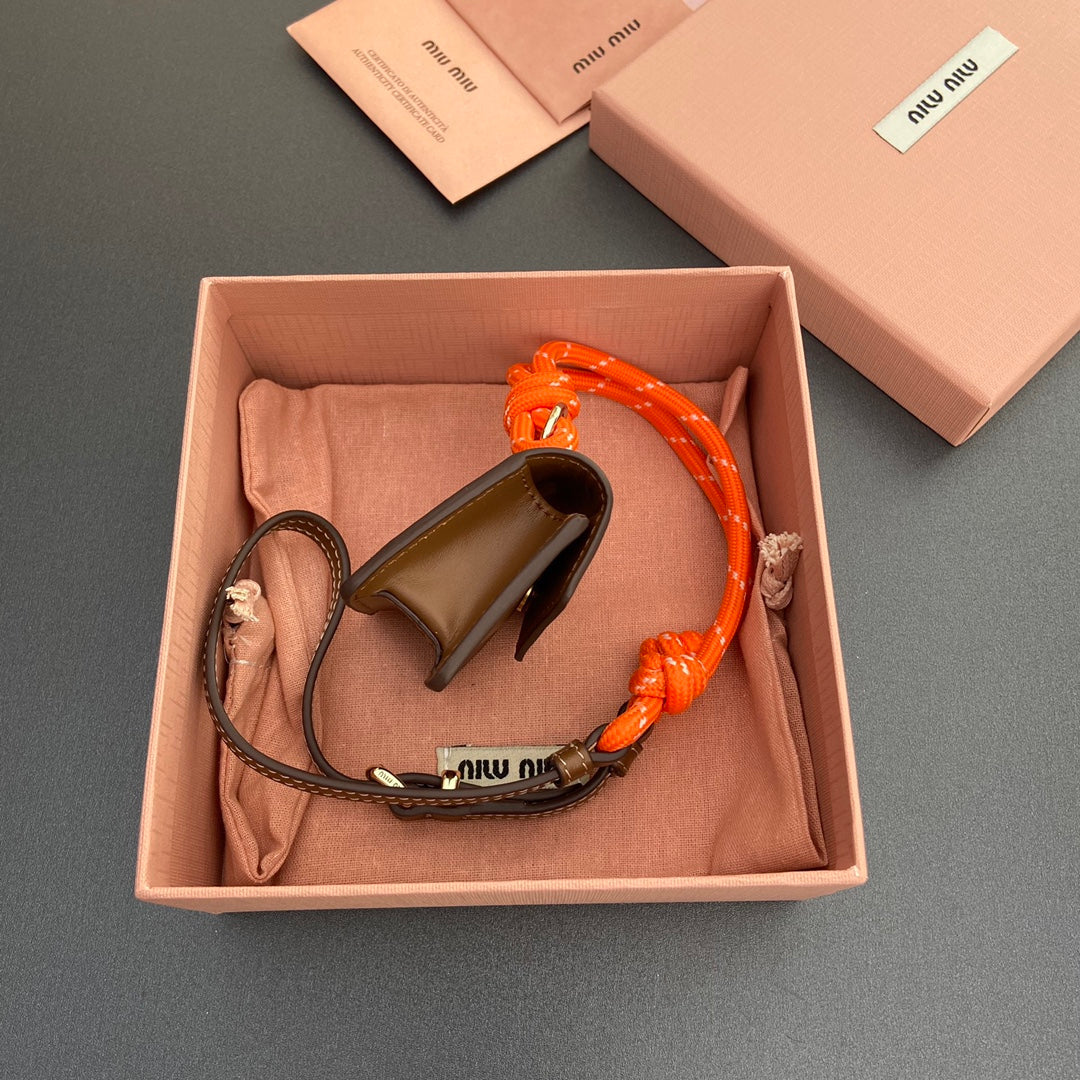 MIU MIU MICRO BAG 7 IN TAWNY BROWN SMOOTH LAMBSKIN ORANGE STRAP