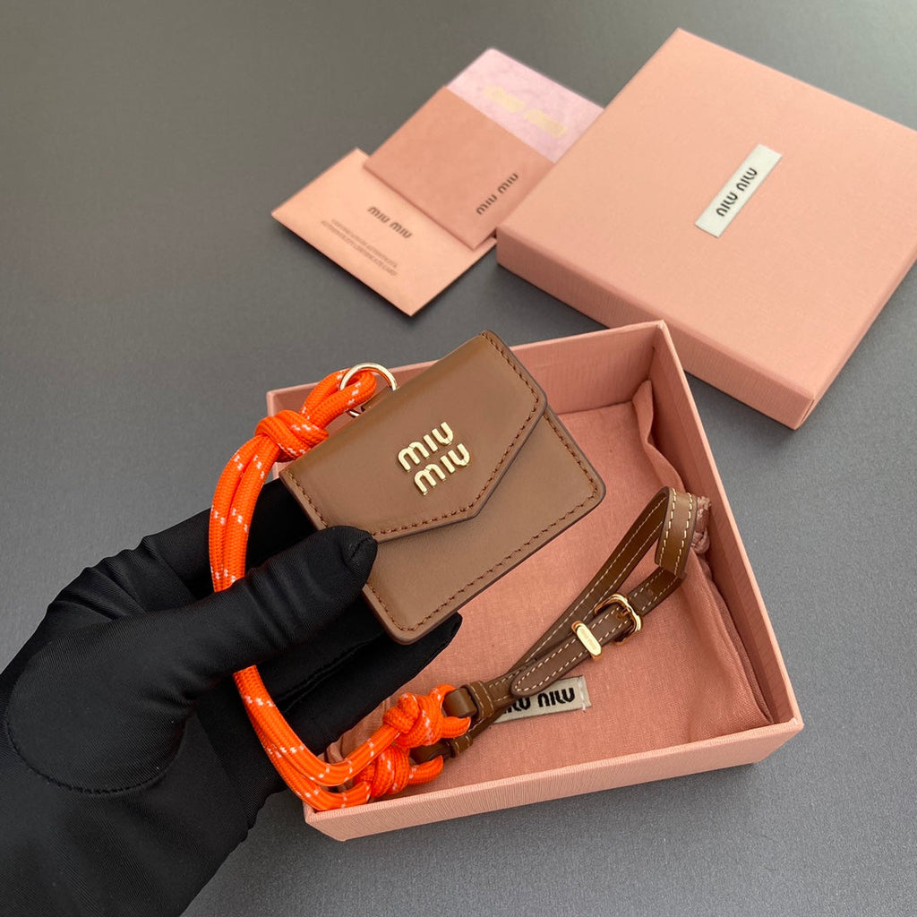 MIU MIU MICRO BAG 7 IN TAWNY BROWN SMOOTH LAMBSKIN ORANGE STRAP