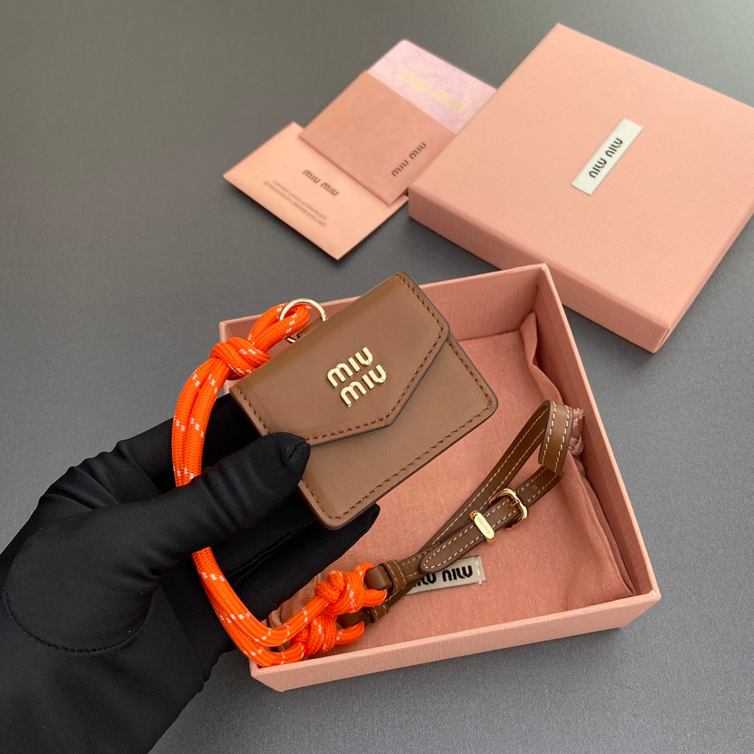 MIU MIU MICRO BAG 7 IN TAWNY BROWN SMOOTH LAMBSKIN ORANGE STRAP