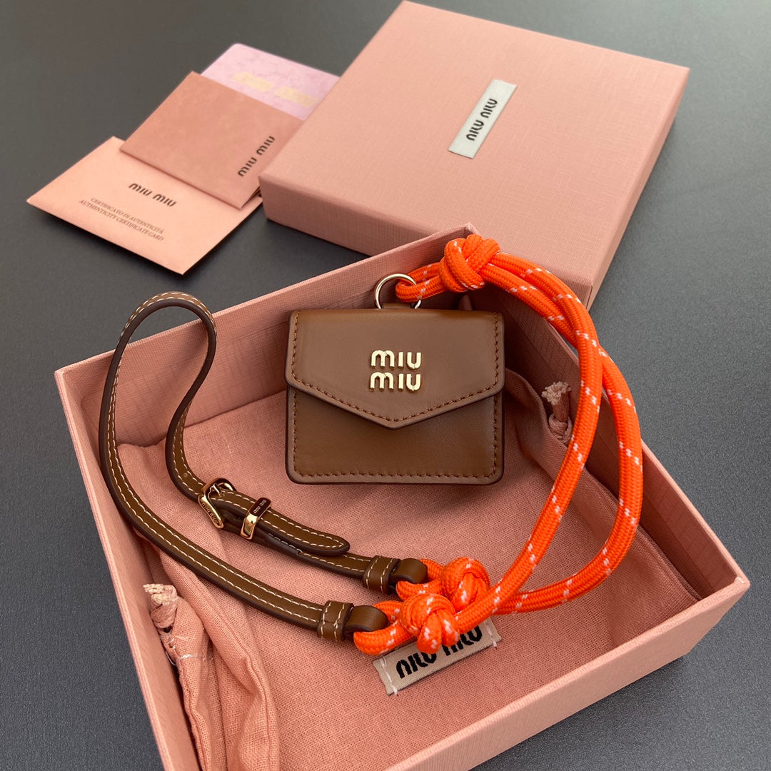 MIU MIU MICRO BAG 7 IN TAWNY BROWN SMOOTH LAMBSKIN ORANGE STRAP