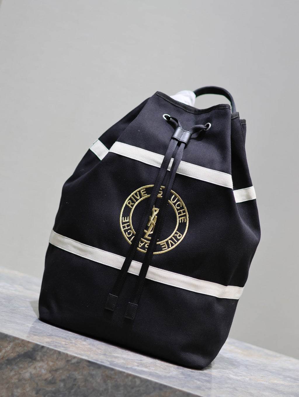 SAINT LAURENT RIVE GAUCHE BACKPACK 49 IN BLACK MIX WHITE CANVAS