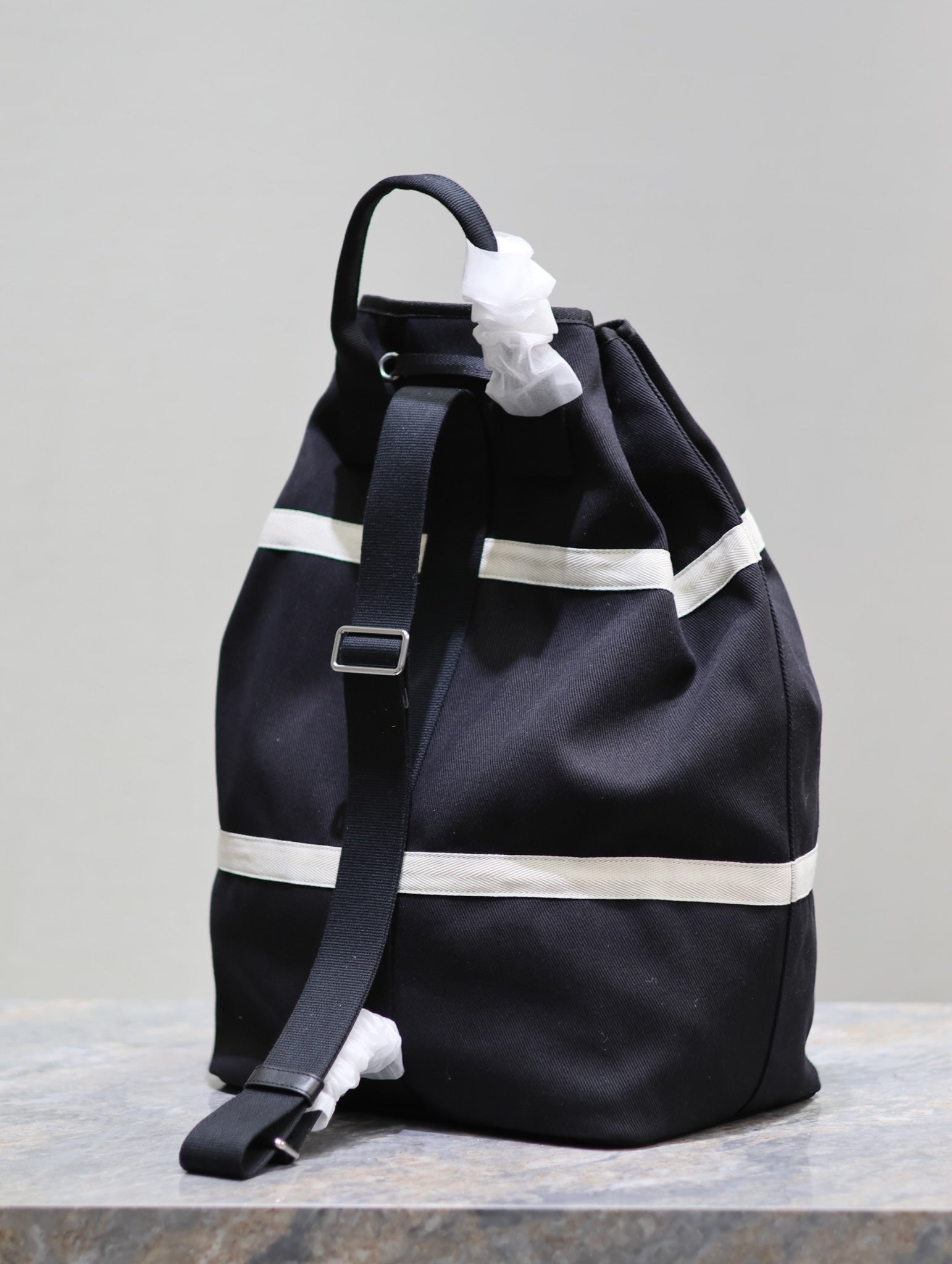 SAINT LAURENT RIVE GAUCHE BACKPACK 49 IN BLACK MIX WHITE CANVAS