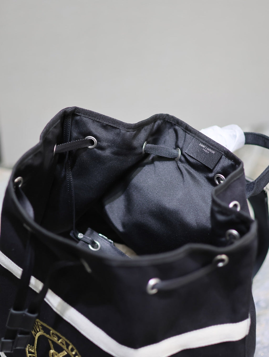 SAINT LAURENT RIVE GAUCHE BACKPACK 49 IN BLACK MIX WHITE CANVAS