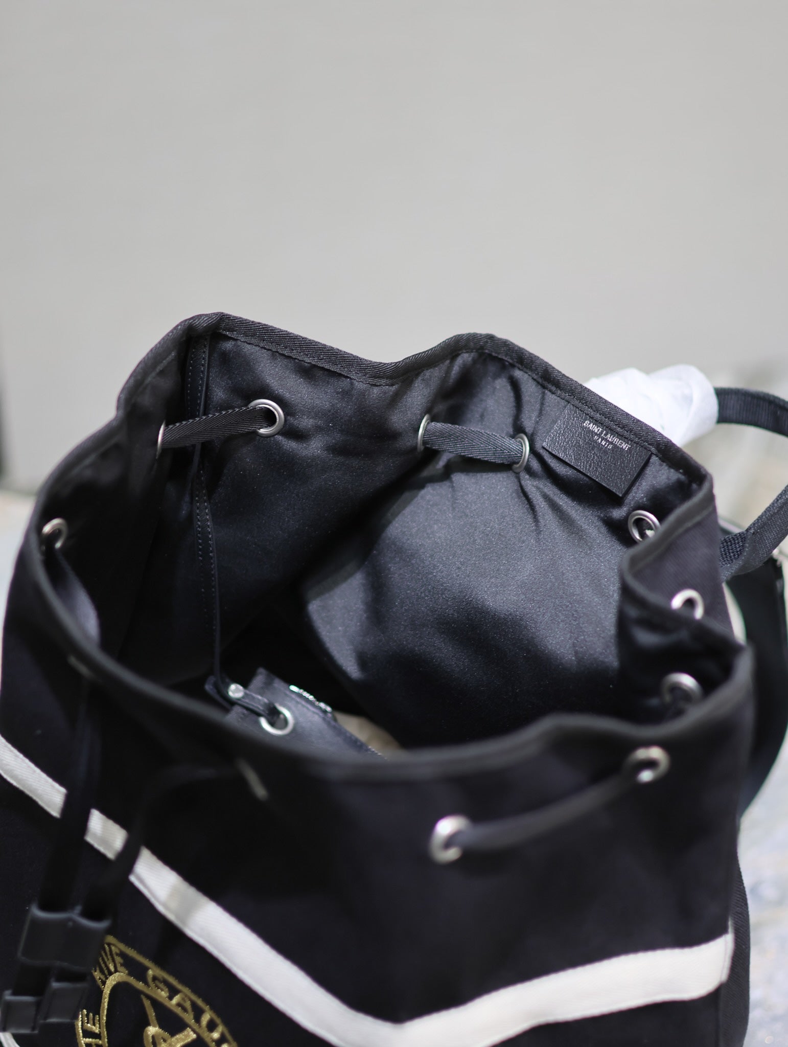 SAINT LAURENT RIVE GAUCHE BACKPACK 49 IN BLACK MIX WHITE CANVAS
