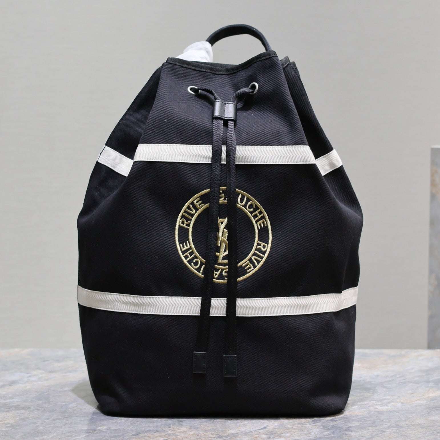 SAINT LAURENT RIVE GAUCHE BACKPACK 49 IN BLACK MIX WHITE CANVAS