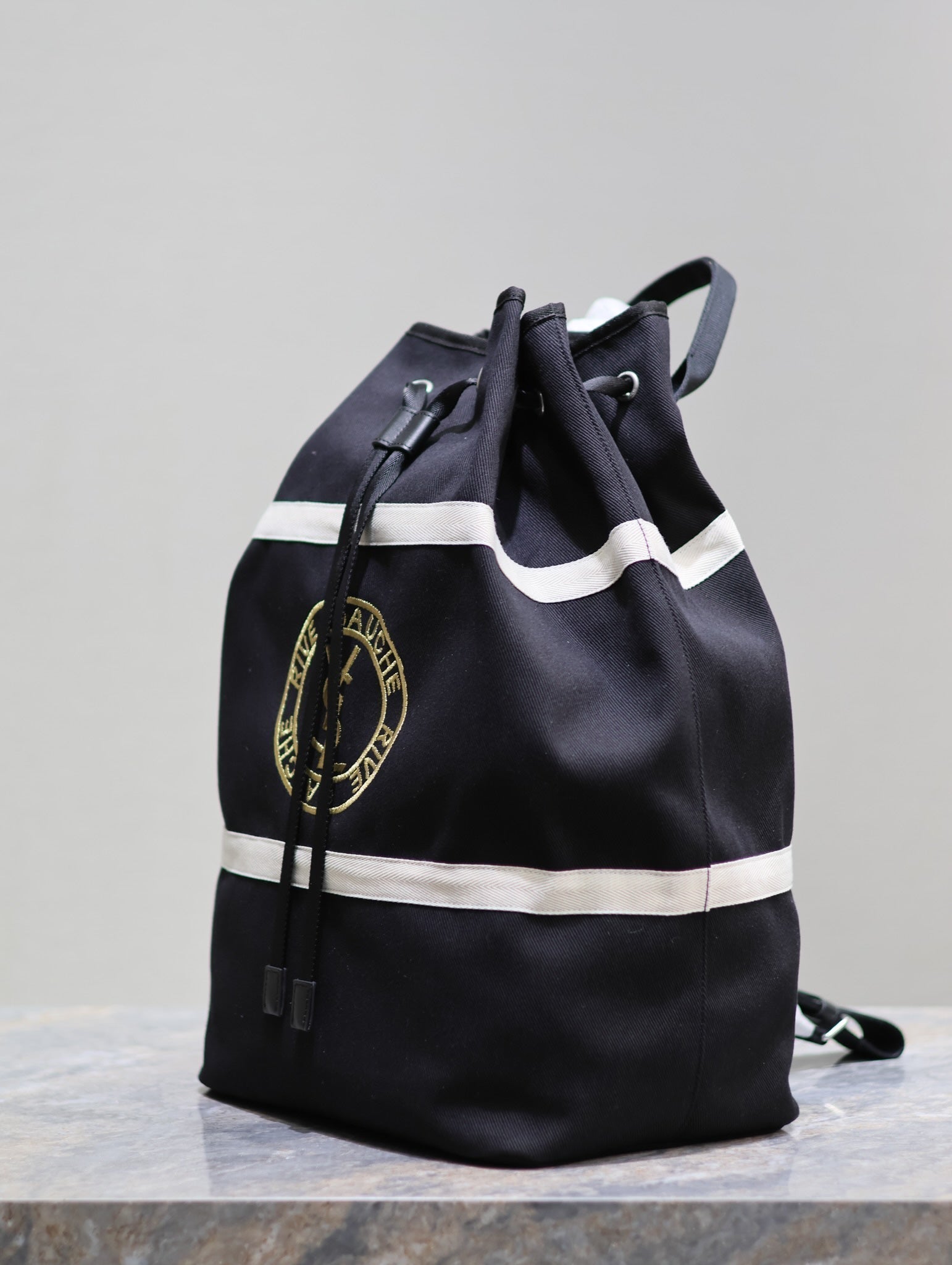 SAINT LAURENT RIVE GAUCHE BACKPACK 49 IN BLACK MIX WHITE CANVAS